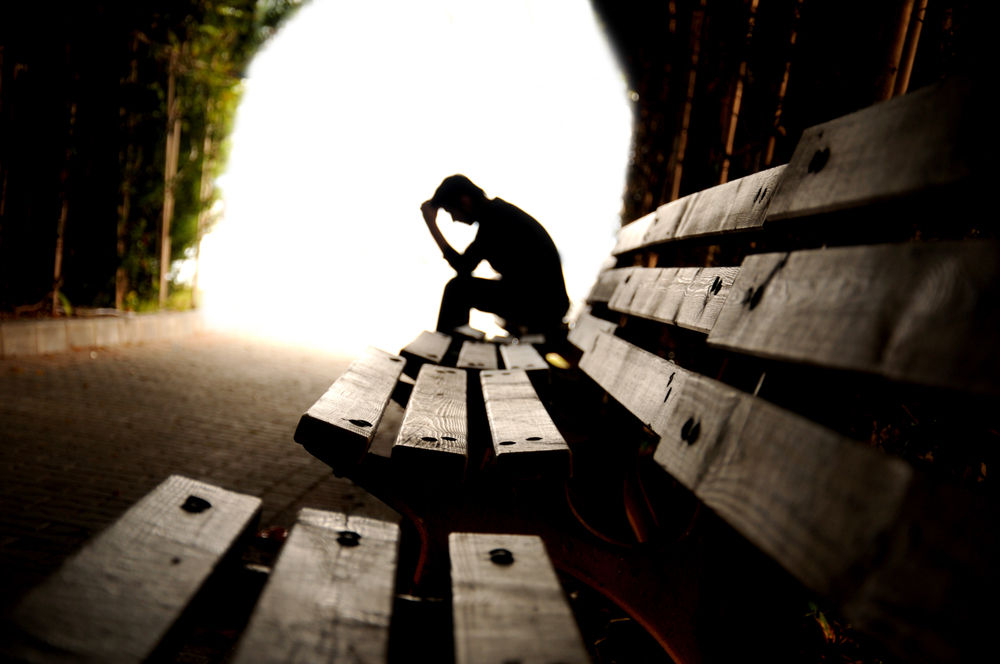 Man alone on a park bench