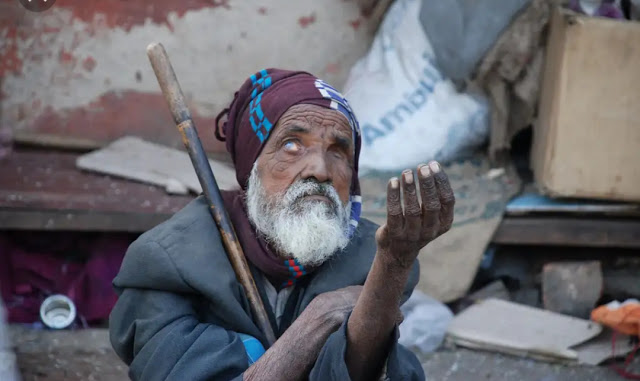 A man begs for alms