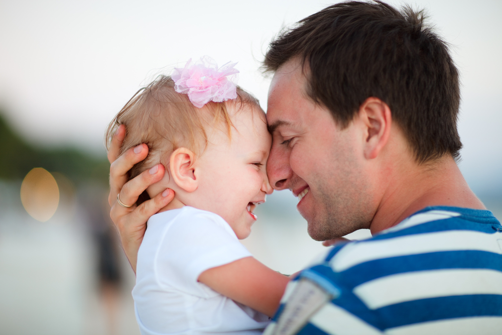 Happy father and baby